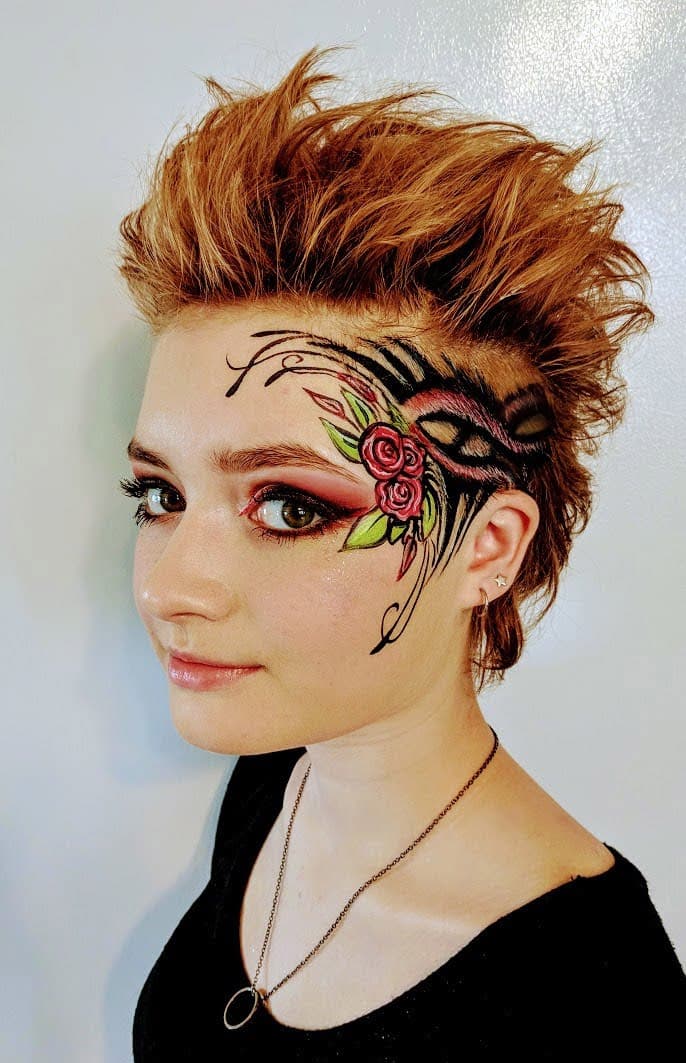 Adult with rose and filigree face paint design