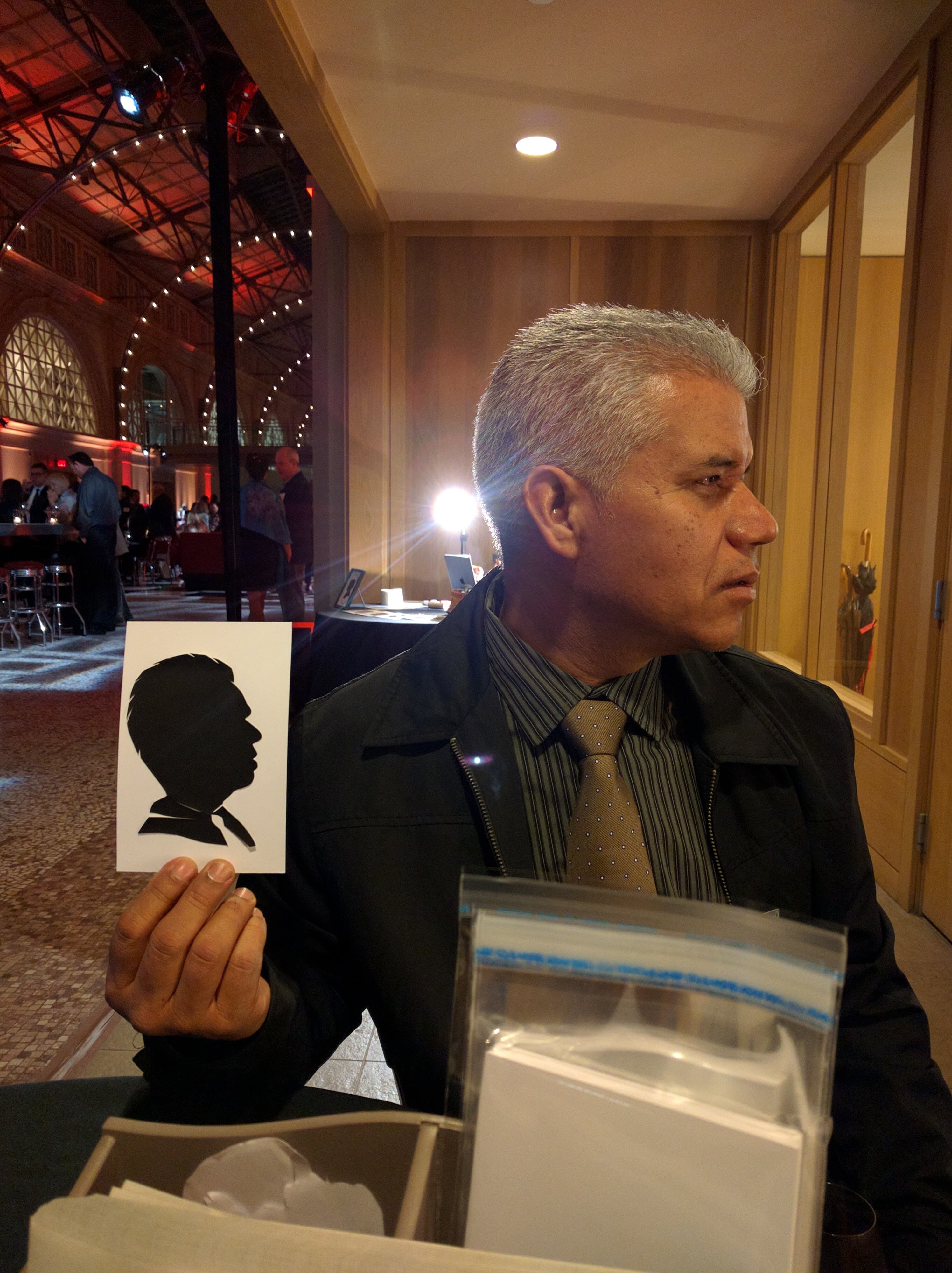 Formal event guest with hand-cut silhouette card